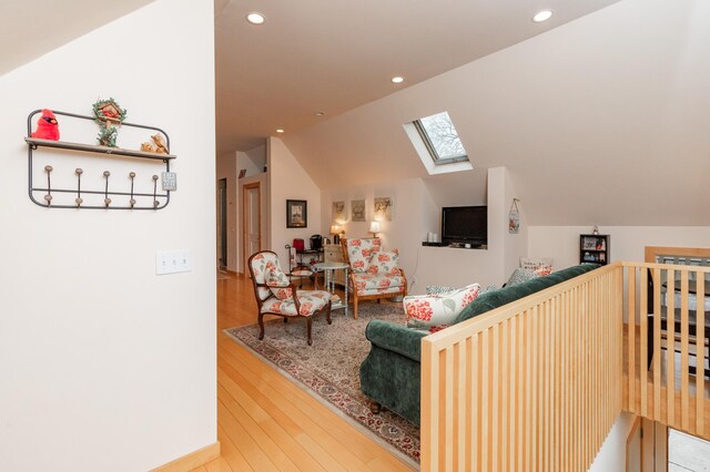 818 Summit Ave, Saint Paul, MN 55105 - living room featuring a skylight, lofted ceiling, recessed lighting, and wood finished floors