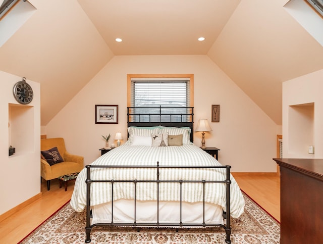 818 Summit Ave, Saint Paul, MN 55105 - bedroom with wood finished floors, vaulted ceiling, baseboards, and recessed lighting
