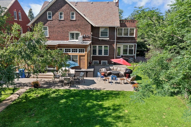 818 Summit Ave, Saint Paul, MN 55105 - back of property with a patio, an outdoor living space with a fire pit, a yard, and brick siding