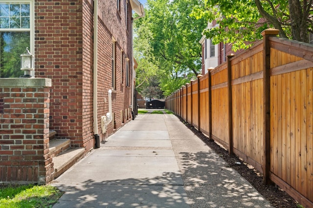 818 Summit Ave, Saint Paul, MN 55105 - view of side of property featuring fence and brick siding