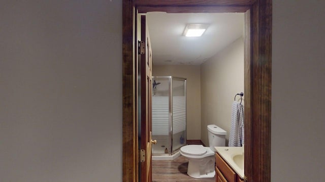14190 Pineview Dr, Becker, MN 55308 - bathroom featuring vanity, a shower stall, and wood finished floors