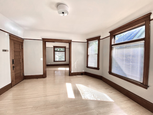 1605 Dupont Ave N, Minneapolis, MN 55411 - empty room featuring light wood finished floors and baseboards