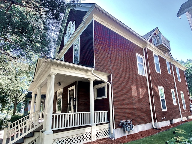 1605 Dupont Ave N, Minneapolis, MN 55411 - view of side of property featuring brick siding and covered porch