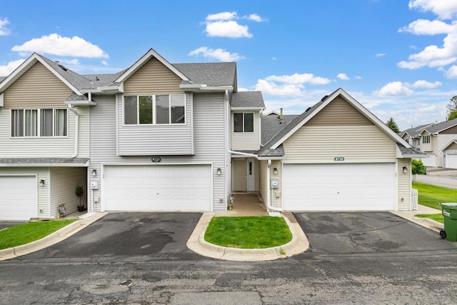 8722 Norway St NW, Coon Rapids, MN 55433 - traditional-style house with asphalt driveway and roof with shingles
