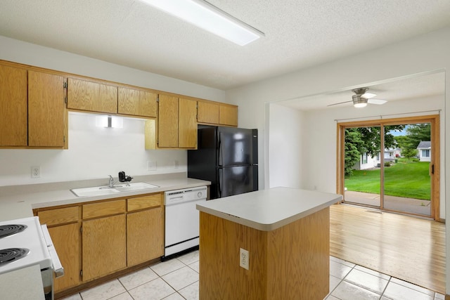 8722 Norway St NW, Coon Rapids, MN 55433 - kitchen with white appliances, a sink, light tile patterned floors, ceiling fan, and light countertops