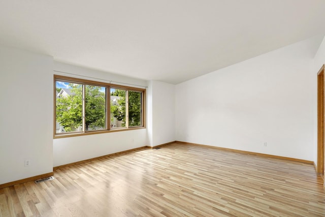 8722 Norway St NW, Coon Rapids, MN 55433 - empty room with light wood-style flooring and baseboards