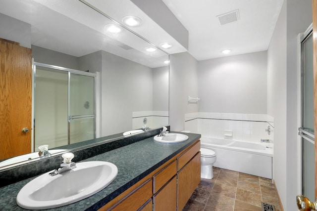 8722 Norway St NW, Coon Rapids, MN 55433 - full bath featuring a bath, stone finish flooring, double vanity, a shower stall, and toilet