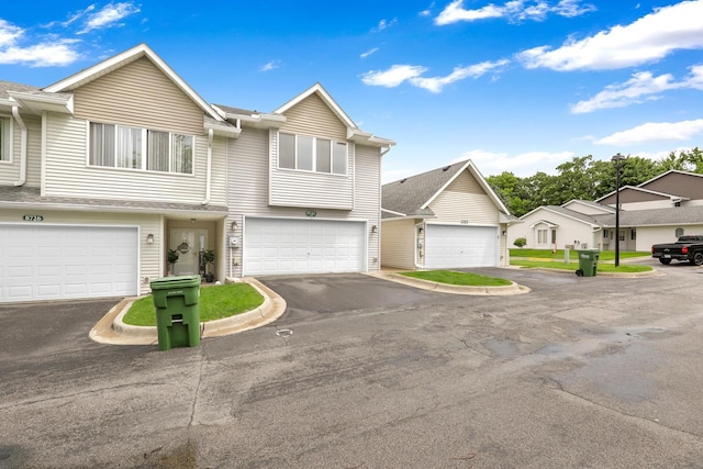 8722 Norway St NW, Coon Rapids, MN 55433 - townhome / multi-family property with a garage