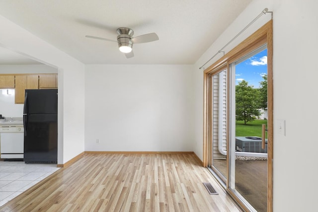 8722 Norway St NW, Coon Rapids, MN 55433 - spare room with light wood-type flooring, ceiling fan, and baseboards