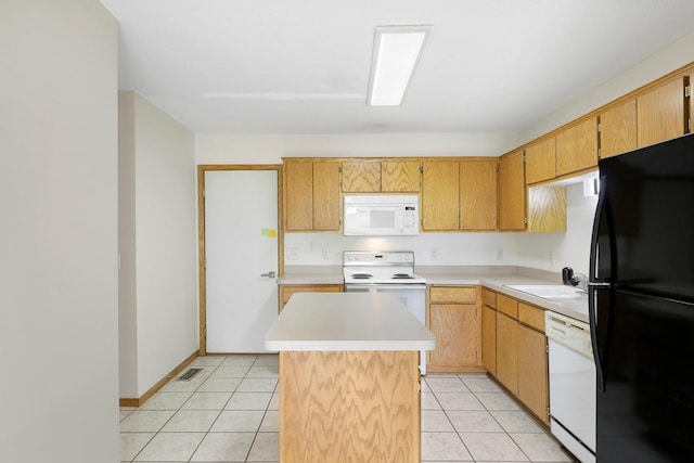 8722 Norway St NW, Coon Rapids, MN 55433 - kitchen with white appliances, a sink, light countertops, a kitchen island, and light tile patterned floors