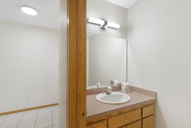8722 Norway St NW, Coon Rapids, MN 55433 - bathroom featuring vanity, tile patterned flooring, and baseboards