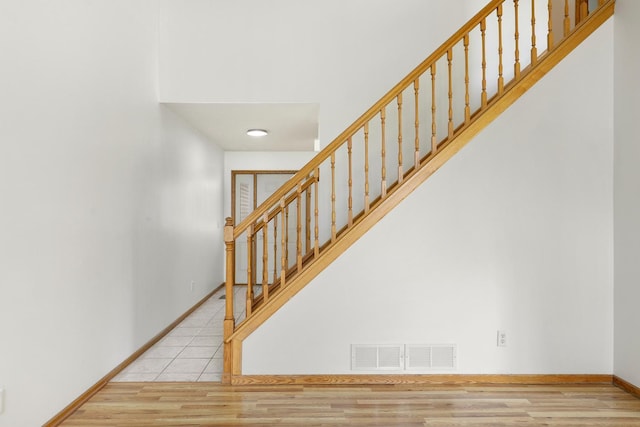 8722 Norway St NW, Coon Rapids, MN 55433 - stairs with baseboards and wood finished floors