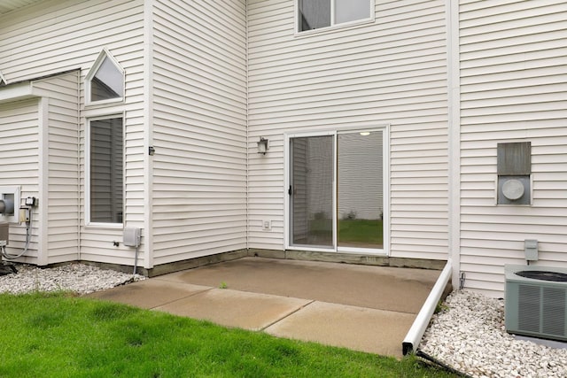 8722 Norway St NW, Coon Rapids, MN 55433 - doorway to property featuring central air condition unit and a patio area