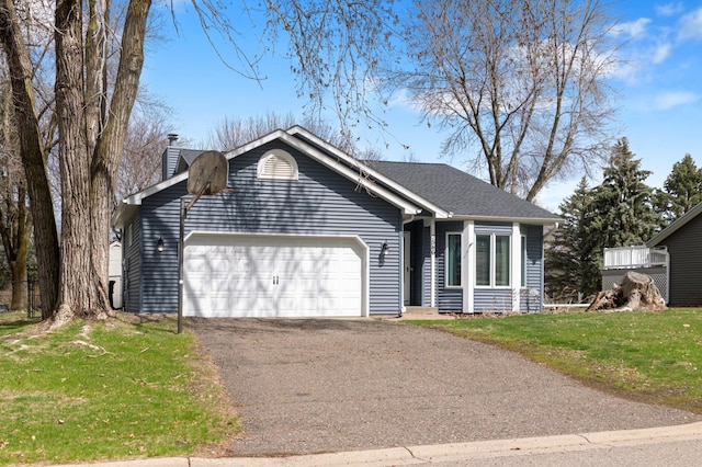 ranch-style house with a chimney, a front lawn, driveway, and an attached garage