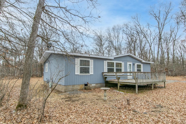 view of front of property with crawl space and a deck