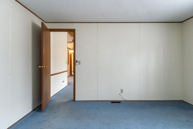 unfurnished bedroom with visible vents, carpet flooring, and crown molding
