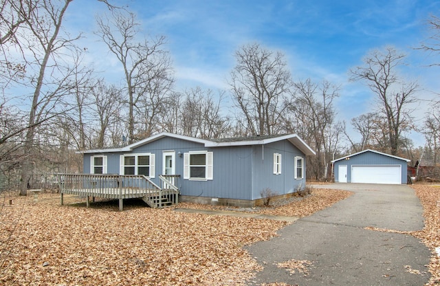 manufactured / mobile home with crawl space, an outbuilding, a deck, and a garage