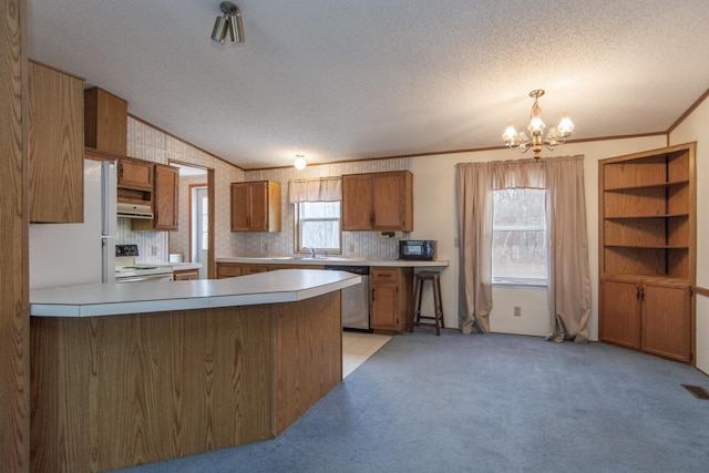 kitchen featuring white electric stove, dishwasher, brown cabinetry, a textured ceiling, and a notable chandelier