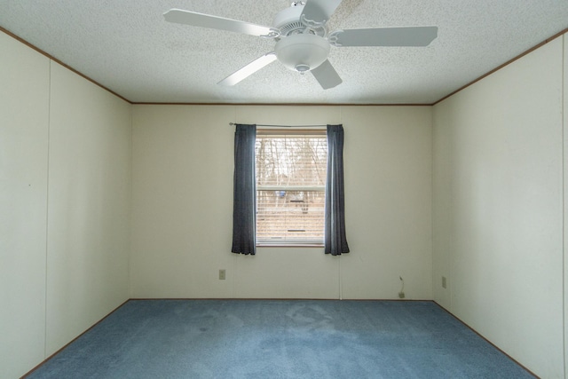 carpeted empty room featuring a textured ceiling and ceiling fan