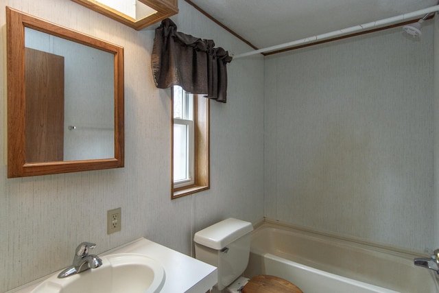 full bathroom featuring vanity, washtub / shower combination, and toilet