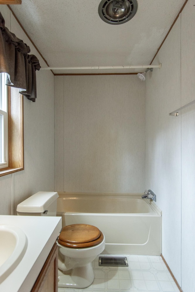 bathroom with tile patterned floors, visible vents, toilet, vanity, and shower / bathing tub combination
