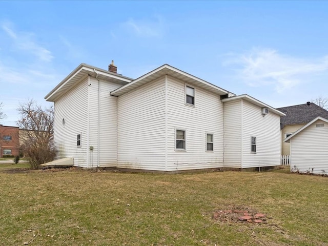 408 Lyon Ave, Lake City, MN 55041 - rear view of house featuring a yard and a chimney