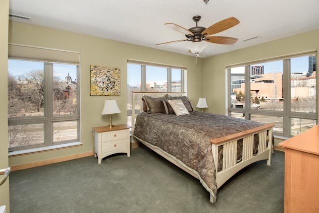 240 Spring St Unit 331, Saint Paul, MN 55102 - carpeted bedroom with visible vents, multiple windows, and ceiling fan