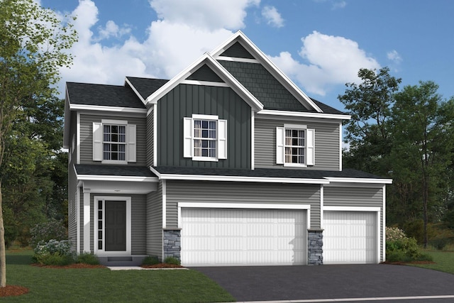view of front of home with board and batten siding, aphalt driveway, stone siding, a front yard, and a garage