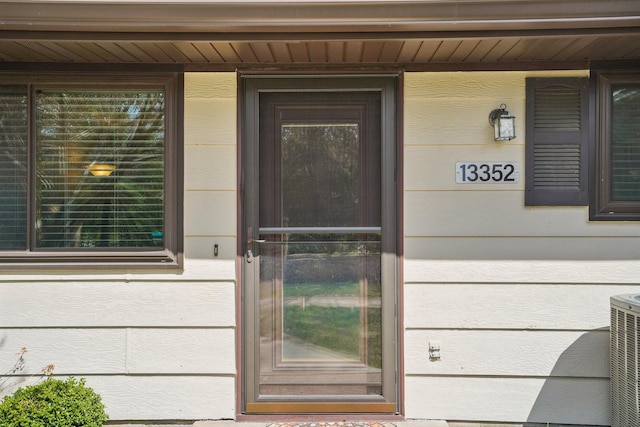 entrance to property featuring central AC