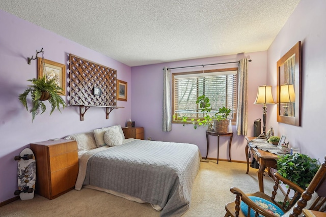bedroom with baseboards, carpet flooring, and a textured ceiling