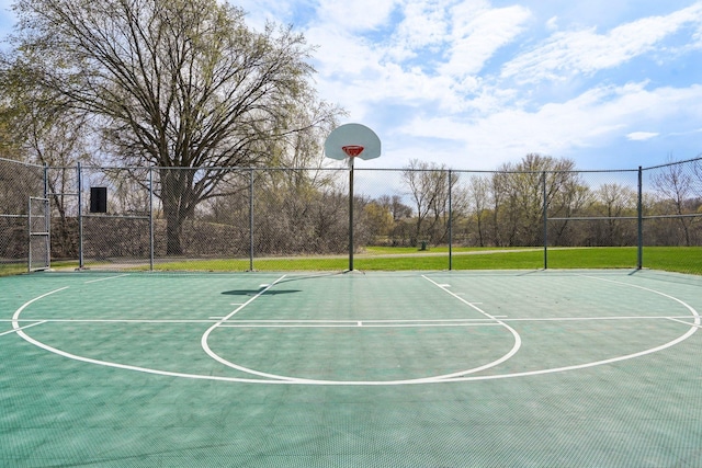 view of basketball court featuring fence and community basketball court