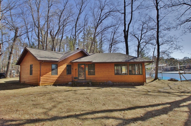 10398 Sandy Beach Rd, Hayward, WI 54843 - chalet / cabin with roof with shingles and log veneer siding