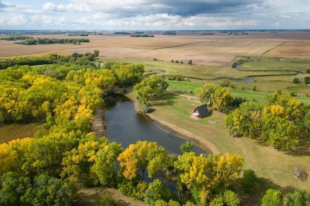 birds eye view of property with a rural view and a water view