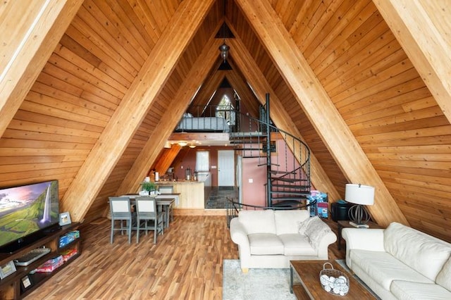 living area featuring stairway, wooden ceiling, wood walls, wood finished floors, and vaulted ceiling with beams