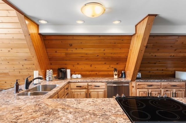 kitchen featuring black stovetop, a sink, light stone countertops, and stainless steel dishwasher