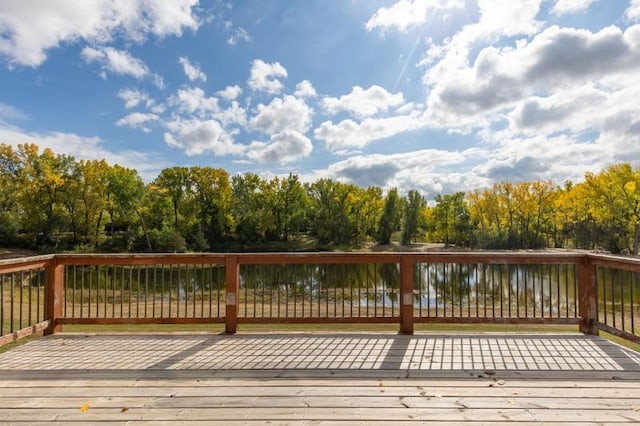 wooden deck featuring a water view