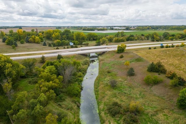 birds eye view of property with a rural view