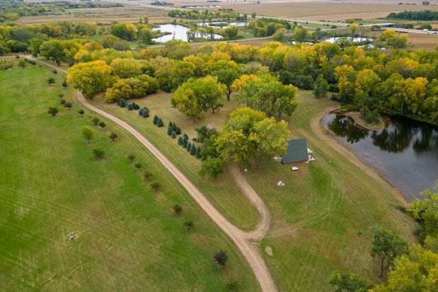 birds eye view of property with a water view and a rural view