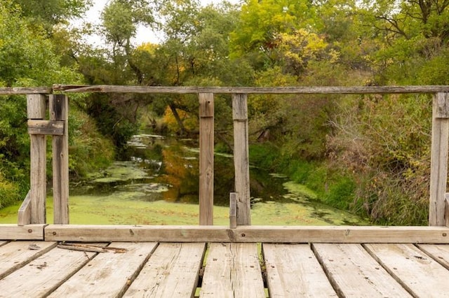 view of gate with a water view