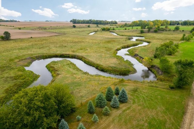 birds eye view of property with a rural view and a water view