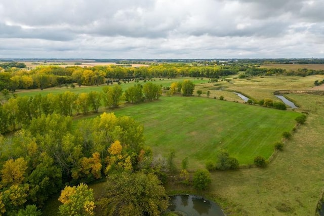birds eye view of property with a rural view
