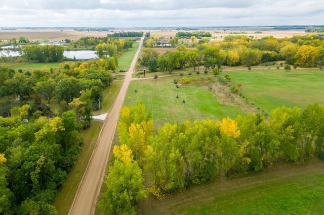 aerial view with a rural view and a water view