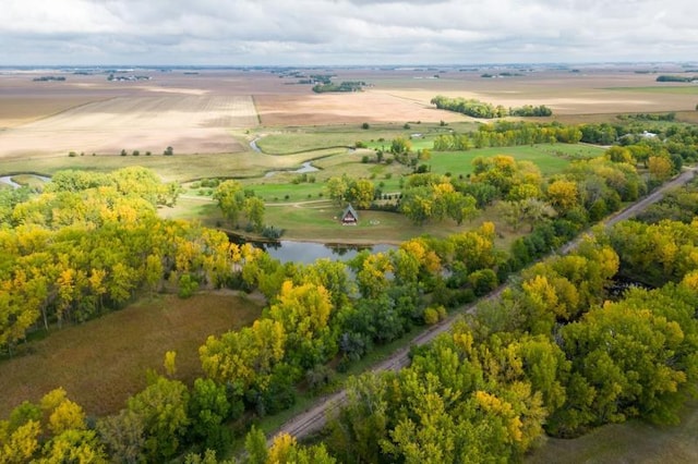 birds eye view of property with a rural view and a water view
