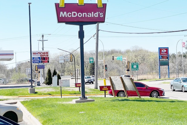 view of road with traffic signs and curbs