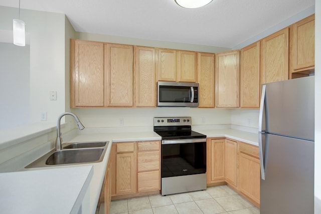 500 2nd St Unit 401, Minneapolis, MN 55401 - kitchen featuring appliances with stainless steel finishes, light brown cabinets, a sink, and light countertops