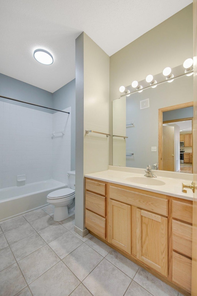 500 2nd St Unit 401, Minneapolis, MN 55401 - full bath featuring tile patterned floors, toilet, vanity, and tub / shower combination