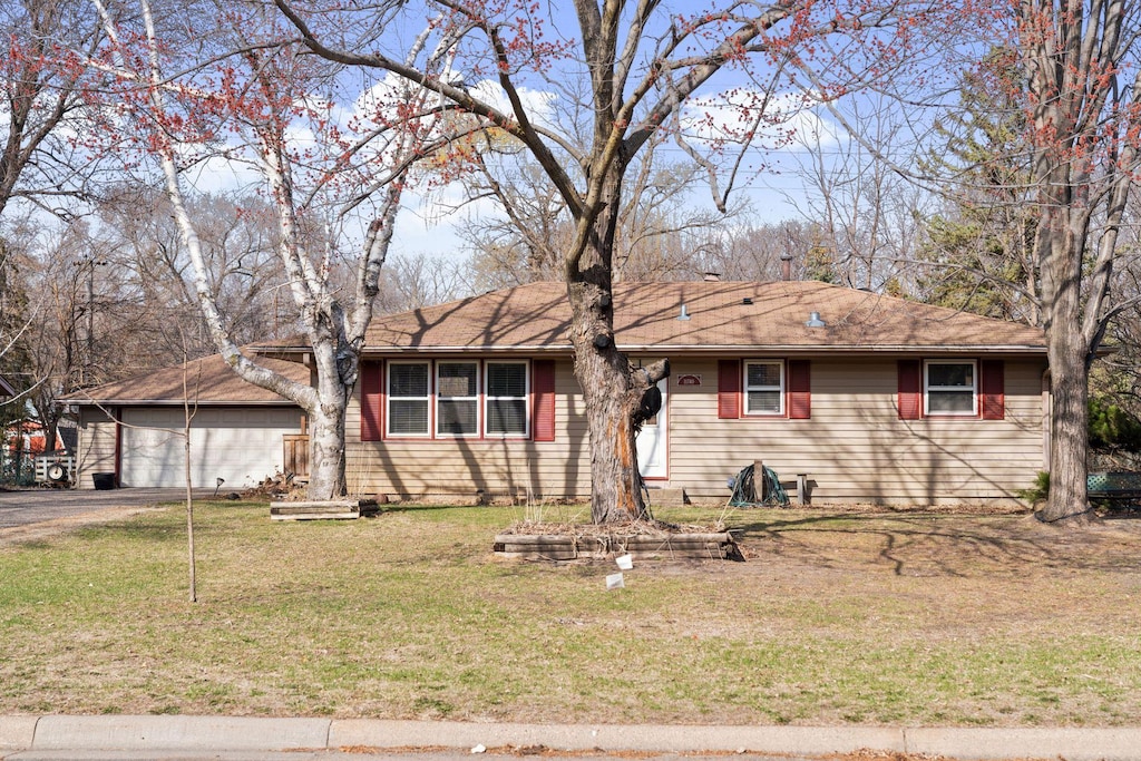 11740 Texas Ave N, Champlin, MN 55316 - single story home with driveway, a front yard, and a garage