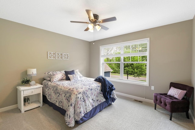 12566 Xylite St NE, Blaine, MN 55449 - carpeted bedroom featuring baseboards and a ceiling fan