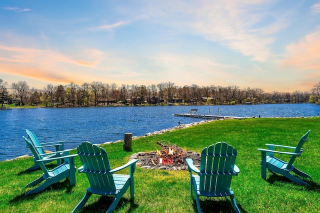 12329 Timber Ln, Maple Grove, MN 55369 - view of grassy yard with a water view and a boat dock