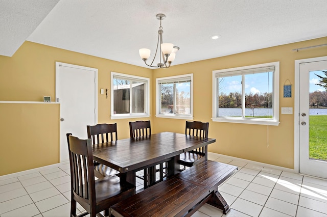 12329 Timber Ln, Maple Grove, MN 55369 - dining area featuring light tile patterned flooring, a chandelier, recessed lighting, and baseboards